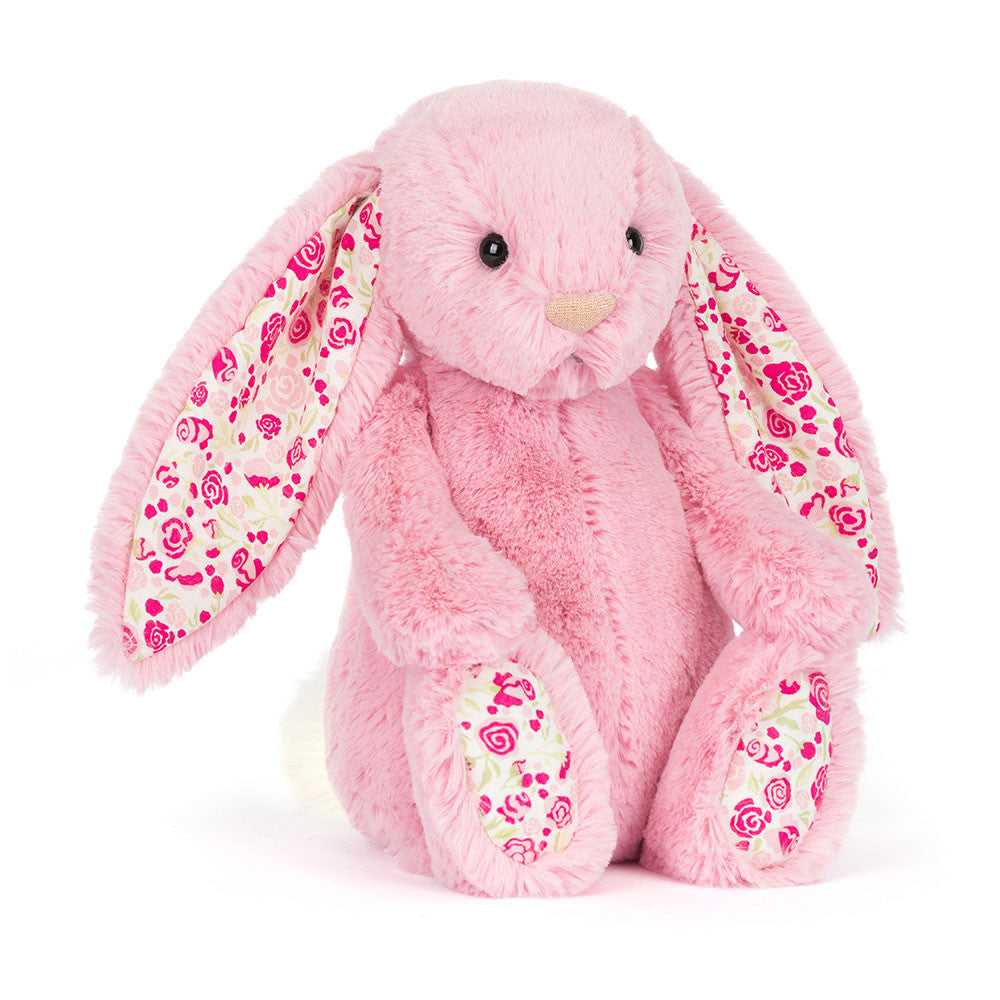 Jellycat pink plush bunny with floral patterned ear lining on a white background.