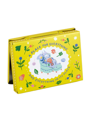 Back view of a yellow pocket box with the text 'A PLACE FOR EVERYTHING AND EVERYTHING IN ITS PLACE' on the cover, featuring an illustration of a grey squirrel sitting on a chair holding an acorn