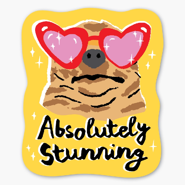 wavy yellow sticker with a front-facing dog wearing red heart sunglasses. bottom text reads "absolutely stunning"
