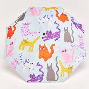 Opened Blue umbrella with an abstract cat print on a white background. 
