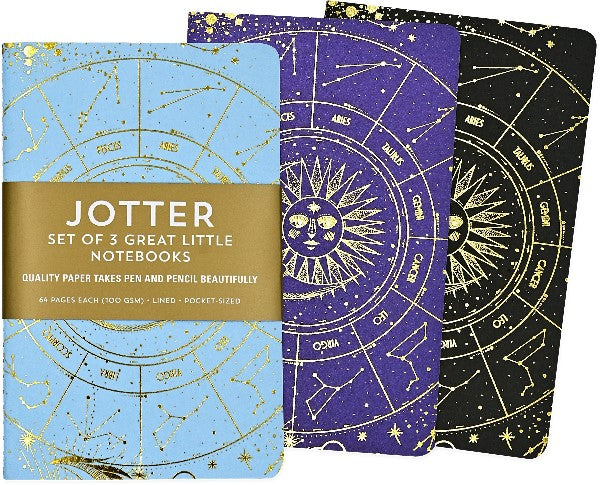 3 notebooks slightly covering one another on a white background. they have the same sun in the middle, astrology circle, golden galaxy design. the notebook colourz are light blue, purple, and black. the blue notebook has a gold wrapping with the text "jotter set of 3 great little notebooks"