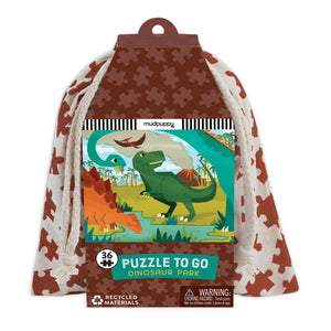 Puzzle packaging with dinosaur illustration and a drawstring bag.