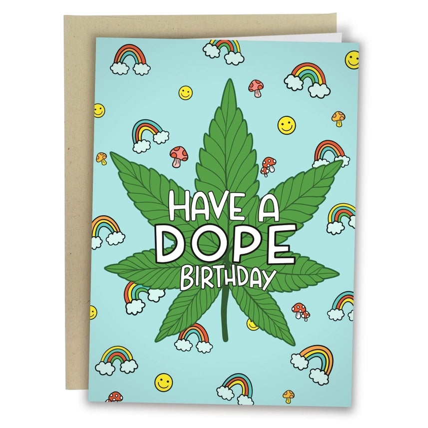 blue birthday card with tiny doodles. centre text reads "have a dope birthday" on a marijuana leaf