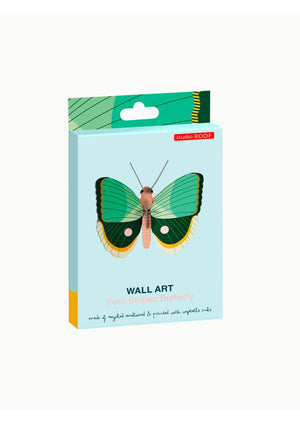 Packaging box for a fern striped butterfly wall art kit from Studio Roof. The box features an image of a green, yellow and white 3D butterfly on a blue background. 
