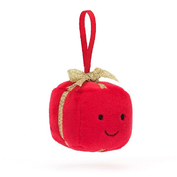 adorably soft plushie of a smilling festive red and gold ornament by popular brand Jellycat.