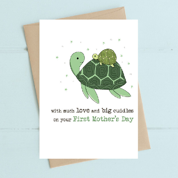 white mother's day card. a sea turtle smiles to the smaller turtle on its back. text below reads "with much love and big cuddles on your first mother's day"