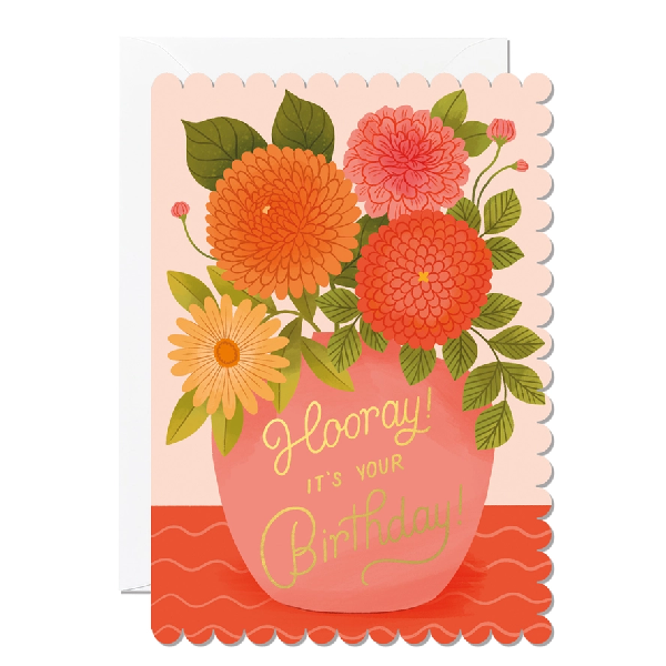 salmon birthday card with rounded, hill-like sides. illustrated orange, pink, and yellow flowers are in a pink vase. gold text on the vase reads "hooray! it's your birthday"