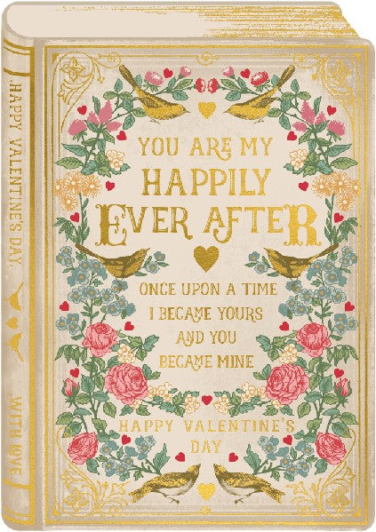 yellow greeting card in the shape of an old-timey book (with the cover, the binding, and the pages viewed in perspective). "you are my happily ever after, once upon a time i became yours and you became mine" and "happy valentine's day" are written in gold on the fake book cover. A mirrored design of flowers and golden birds fill the empty space of the fake book cover