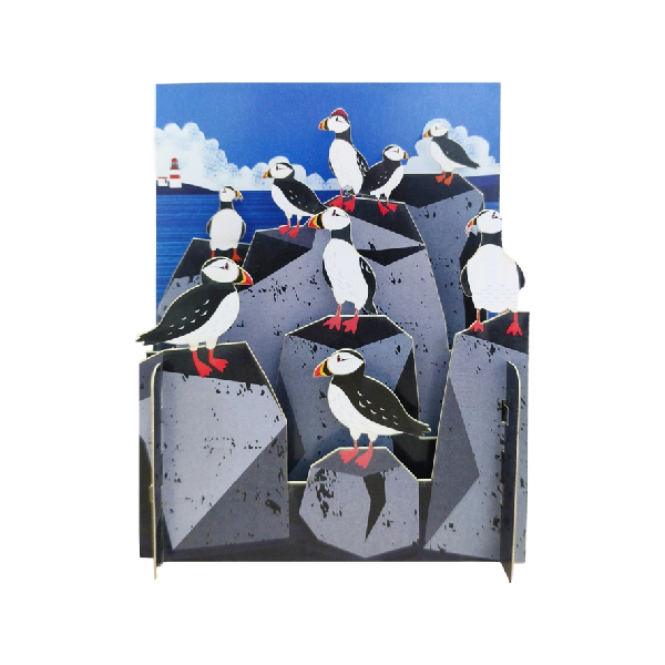 miniature pop up card depicting a rocky shoreline scene with puffins