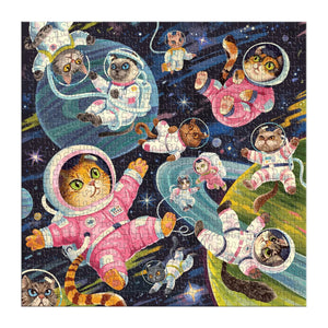 Finished puzzle featuring illustrations of cat astronauts floating in space along with some planets and stars in the background. 