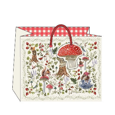 Decorative gift bag with forest-themed design featuring animals and mushrooms on a white background.