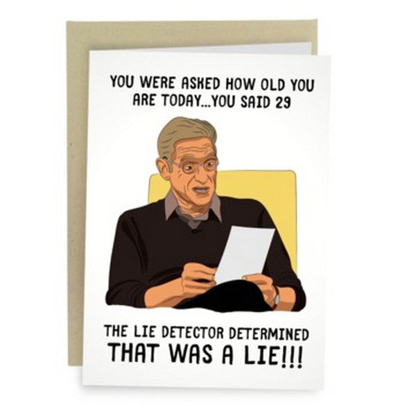 white birthday card with a caricature of Maury reading a paper. top text reads "you were asked how old you are today... you said 29". bottom text reads "the lie detector determined that was a lie!!!"