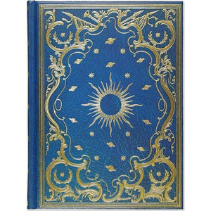 royal blue leatherette notebook with intricate golden details. tiny stars and planets suround the outline of a sun at the centre