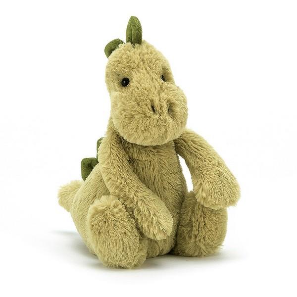 adorably soft plushie of a pale green dinosaur by popular brand Jellycat.