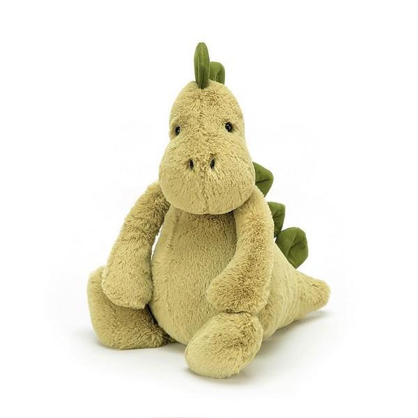 adorably soft plushie of a pale green dinosaur by popular brand Jellycat.
