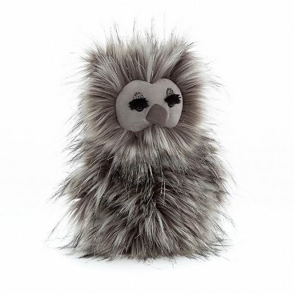 adorably soft plushie of an owl with thick eyelashes and glitter lids by popular brand Jellycat.