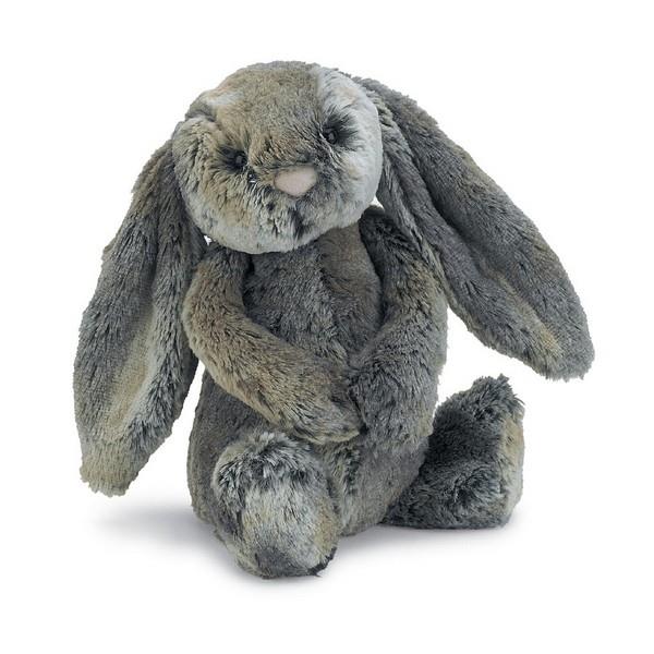 adorably soft plushie of a dark grey bunny by popular brand Jellycat.