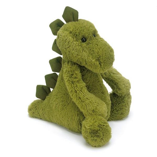 adorably soft plushie of a green dino with scales along its back by popular brand Jellycat.